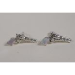 A pair of sterling silver cufflinks in the form of pistols with mother of pearl handles, 1" long