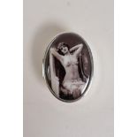 A sterling silver pill box, the cover with a cold enamel plaque depicting Victorian erotica, 1½" x