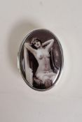 A sterling silver pill box, the cover with a cold enamel plaque depicting Victorian erotica, 1½" x