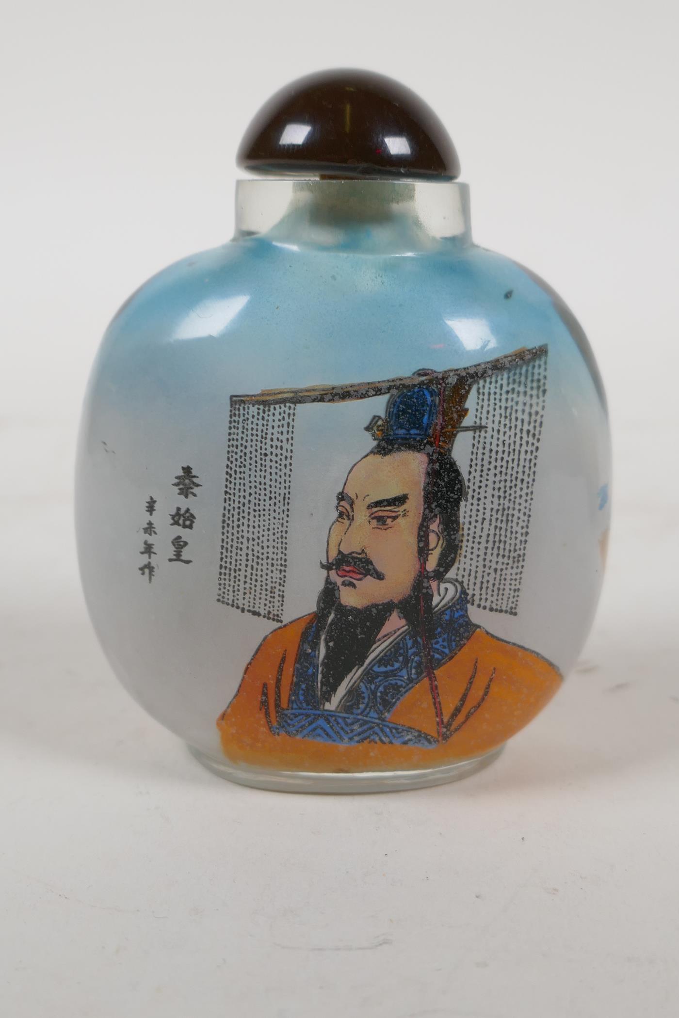 A Chinese reverse decorated glass snuff bottle depicting the great wall and a portrait of a noble, - Image 3 of 5