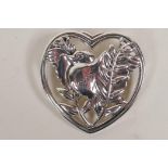 A Danish silver brooch shaped as a dove within a heart
