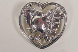 A Danish silver brooch shaped as a dove within a heart