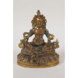 A Sino Tibetan gilt bronze figure of a seated deity with inset turquoise and red agate stones,
