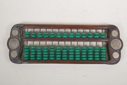 A Chinese hardwood and turquoise bead abacus set with Chinese white metal coins, 16½" x 5½"