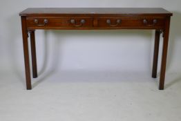 A Chippendale style two drawer mahogany side table, with reeded edge top and brass swan neck