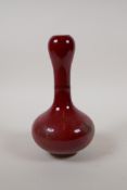 A flambe glazed porcelain garlic head vase, Chinese KangXi mark to base, 8" high