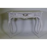 A serpentine front single drawer side table with carved and painted decoration, 36" x 19" x 29"
