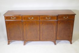 A mahogany breakfast side cabinet, with cross banded inlay, four drawers over four cupboards, raised