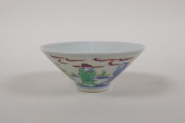 A Chinese Doucai porcelain conical bowl decorated with figures in a garden, 6 character mark to