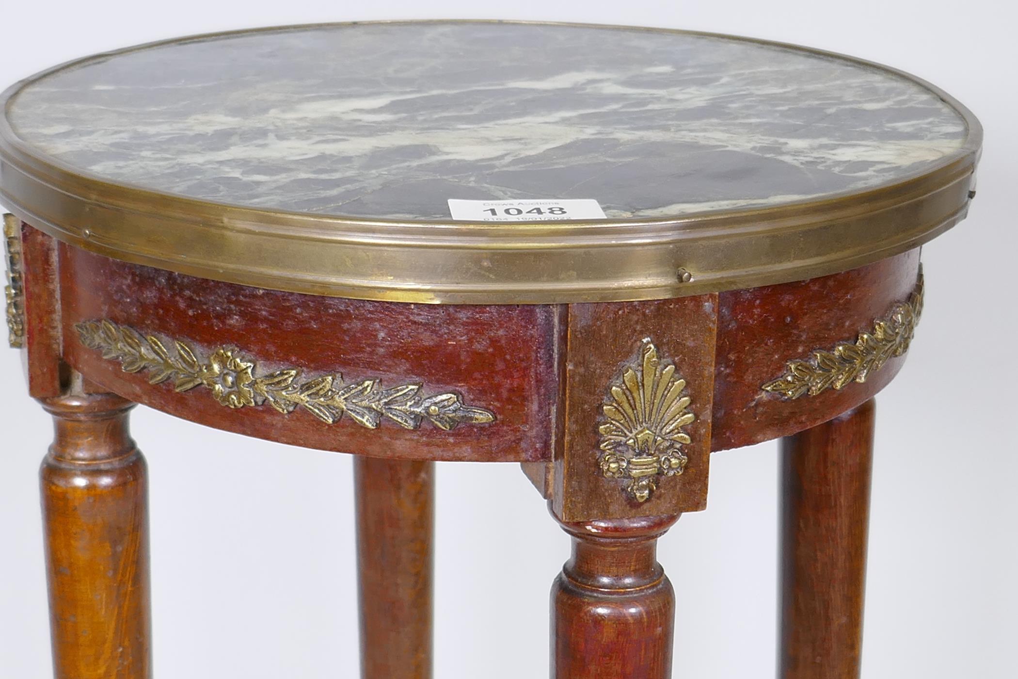 A French Empire style gueridon, with brass mounts and inset vert de mer marble top, raised on turned - Image 3 of 3