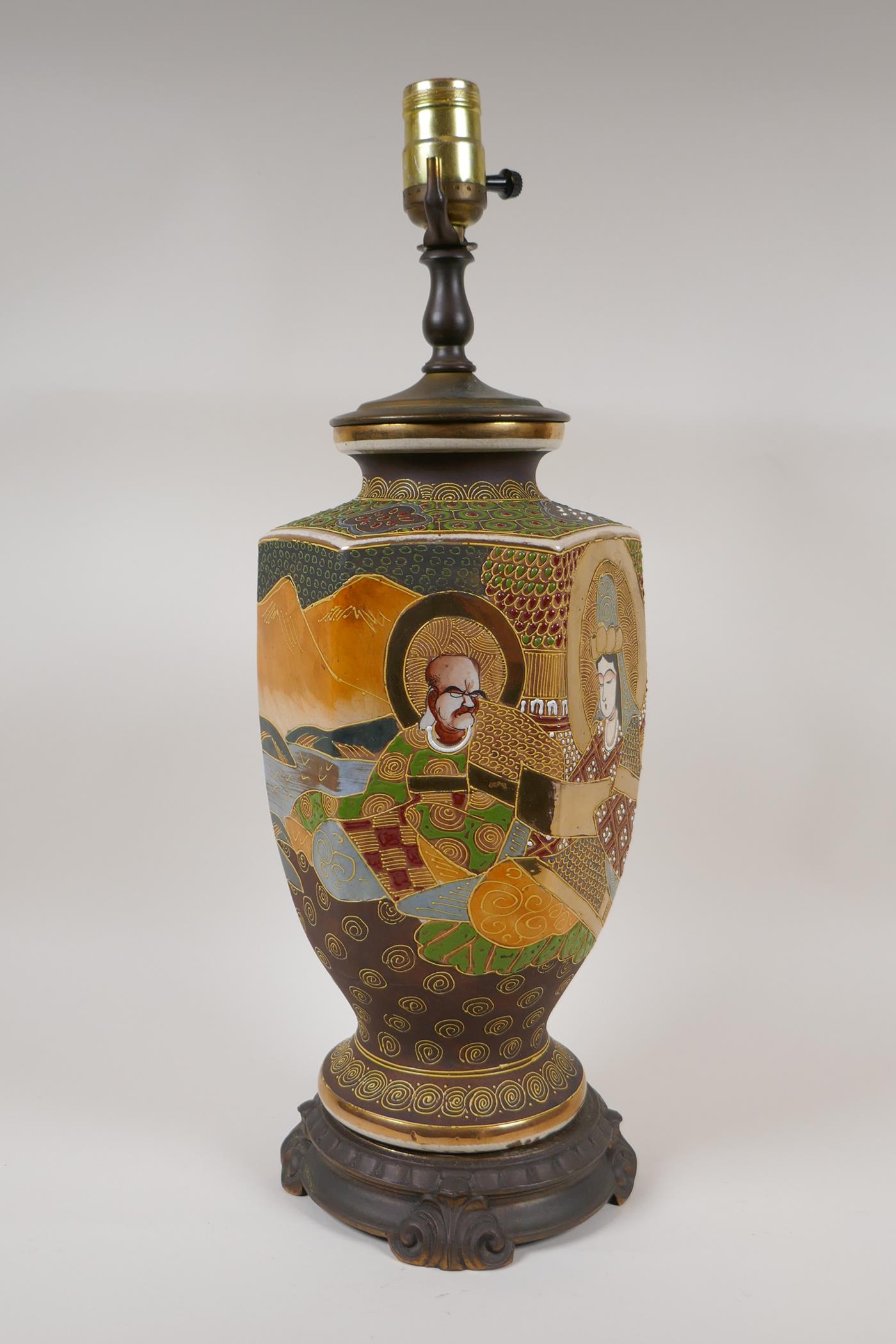 A Japanese Satsuma pottery lamp with figural decoration and bronzed metal mounts, 18½" high