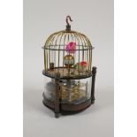 A brass cased bird cage automaton clock, 6" high, 4½" diameter