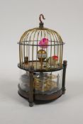 A brass cased bird cage automaton clock, 6" high, 4½" diameter