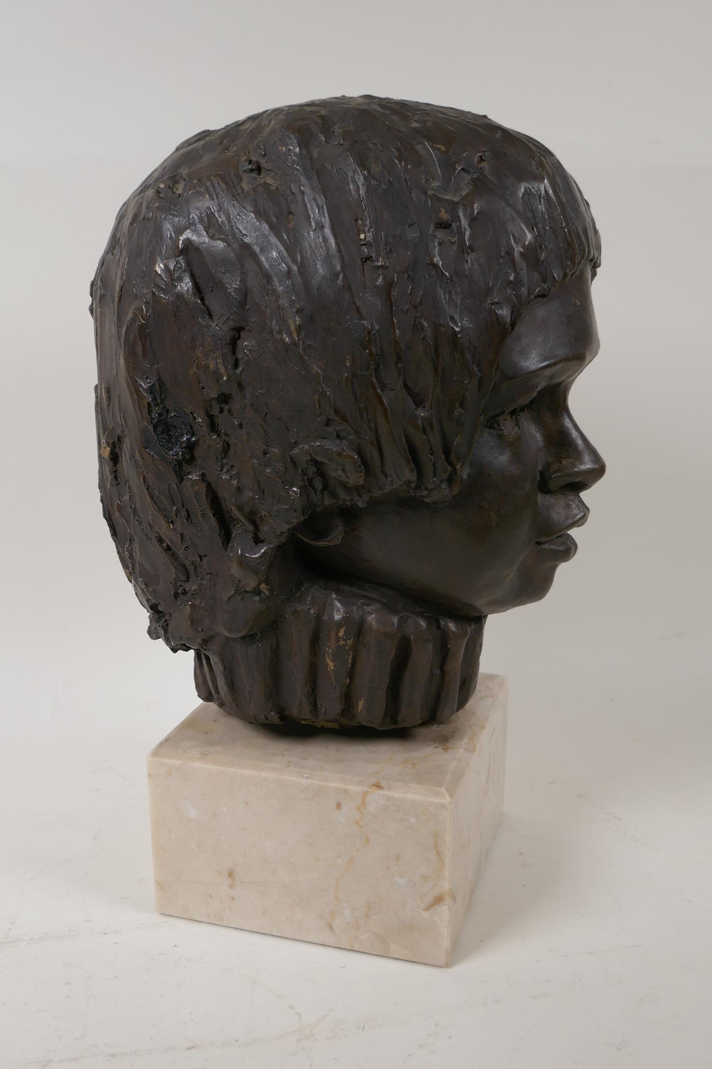 A bronzed composition bust of a child's head, on a square stone plinth, signed, 13" high - Image 2 of 4