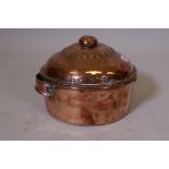 A C19th copper dish and cover, adapted from a pan, the cover impressed T.J. Warne, tinsmith,