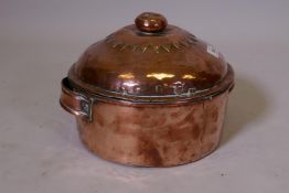 A C19th copper dish and cover, adapted from a pan, the cover impressed T.J. Warne, tinsmith,