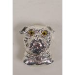 A silver pendant brooch formed as the head of a dog with glass eyes