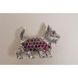 A sterling silver and ruby set brooch in the form of a Scottish terrier, 1½" long
