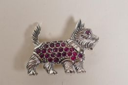 A sterling silver and ruby set brooch in the form of a Scottish terrier, 1½" long