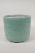 A Chinese  celadon glazed porcelain planter raised on tripod supports, with underglaze archaic style