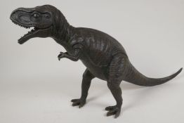 A cast bronze figure of a T-Rex dinosaur, 11" high