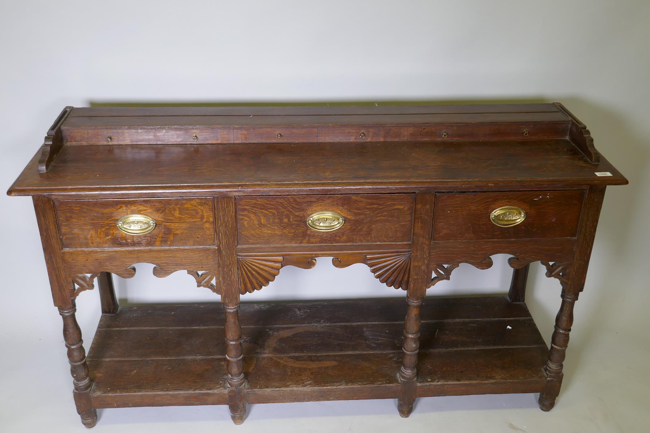 A Georgian oak Welsh potboard dresser, the upper rack with shaped frieze and two shelves, the base - Image 3 of 5