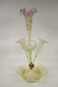 A Victorian vaseline glass epergne with four trumpets, on a petal bowl base, 21" high