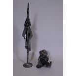 A metal figure of a wizard and another, 36" high
