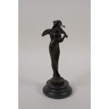 An Art Nouveau style bronze figure of a woman playing the violin, 7½" high