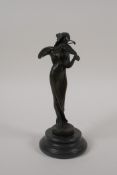 An Art Nouveau style bronze figure of a woman playing the violin, 7½" high