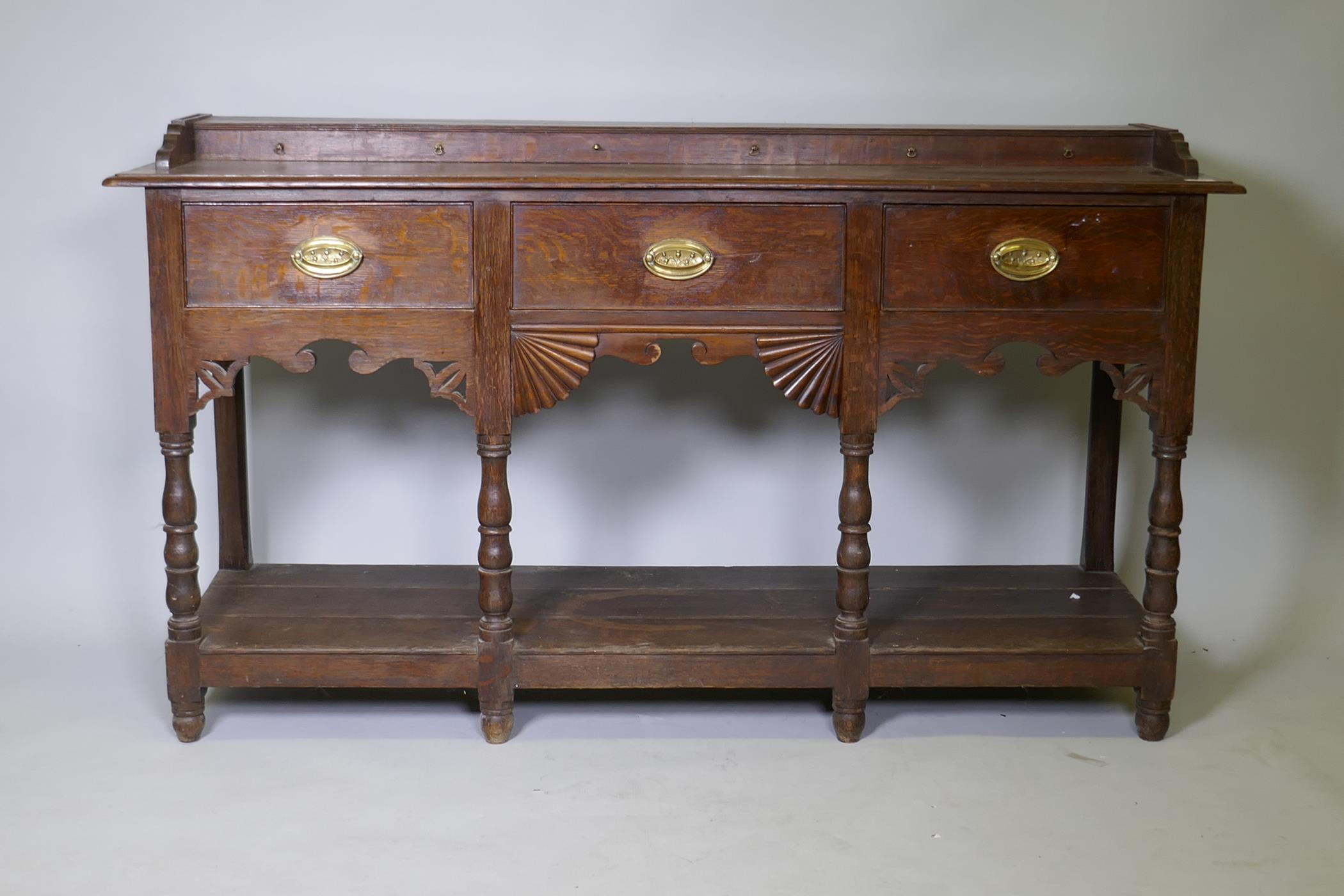 A Georgian oak Welsh potboard dresser, the upper rack with shaped frieze and two shelves, the base - Image 2 of 5