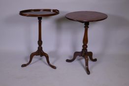 A Georgian mahogany lamp table with galleried oval top, raised on a turned column and tripod