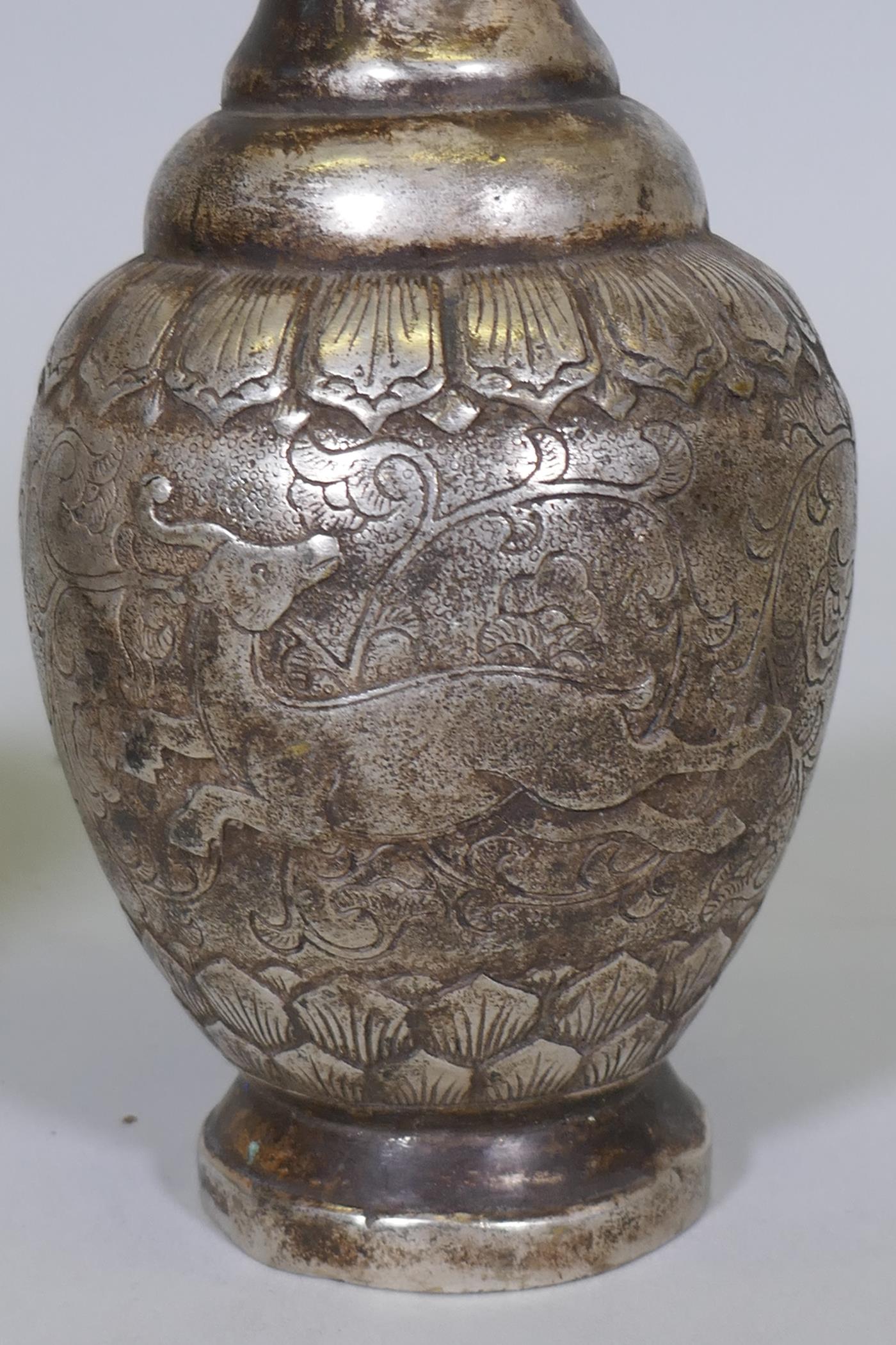 A pair of Chinese white metal vases with raised decoration depicting a lion chasing a deer, seal - Image 3 of 5