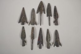 Ten archaic style bronze arrow heads, 3" long