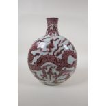 A Chinese red and white porcelain moon flask with dragon decoration, 12" high