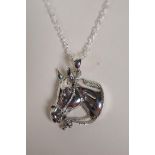 A sterling silver horse head pendant necklace, 1" drop