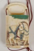 A Japanese carved and dyed three section bone inro decorated with horses, 2" long