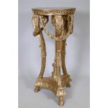 A gilt composition stand with inset marble top and classical style decoration of garlands and urn,