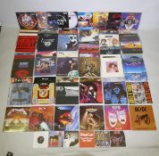 A quantity of 12" metal and rock vinyl LPs including Metallica, Meatloaf, Thin Lizzy, Motorhead,