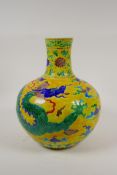 A Chinese yellow ground porcelain fahua vase with dragon and lotus flower decoration in the Sancai