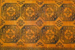 A gold ground full pile Bokhara carpet, 61" x 81"