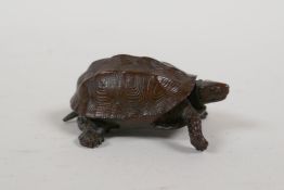 A Japanese bronze Jizai style okimono tortoise with an articulated head and tail, impressed mark to