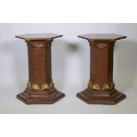 A pair of burr elm and parcel gilt pedestals, 29" x 19" diameter