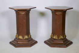 A pair of burr elm and parcel gilt pedestals, 29" x 19" diameter