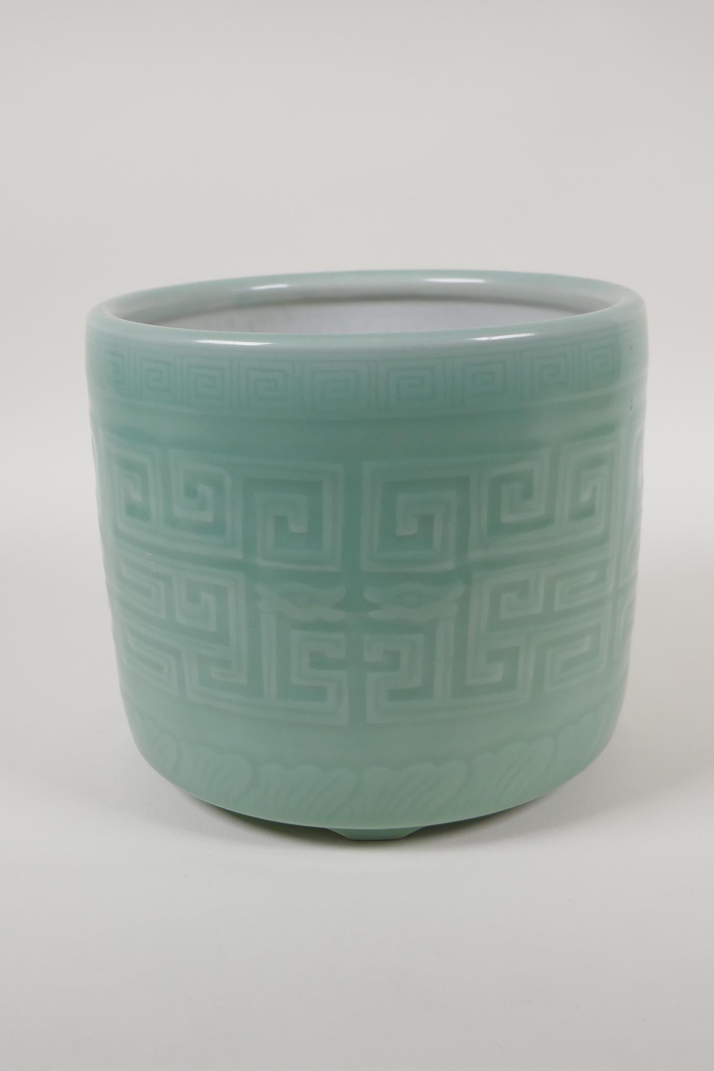 A Chinese  celadon glazed porcelain planter raised on tripod supports, with underglaze archaic style - Image 3 of 4