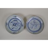 A pair of early C20th Chinese blue and white porcelain dishes with stylised hand painted dragon