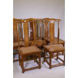 A set of eight Chinese elm yoke back chairs, late C20th