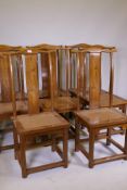 A set of eight Chinese elm yoke back chairs, late C20th