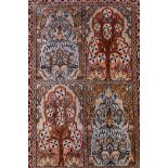 An oriental silk multicolour ground rug with a panelled field depicting the tree of life, 25" x 37"