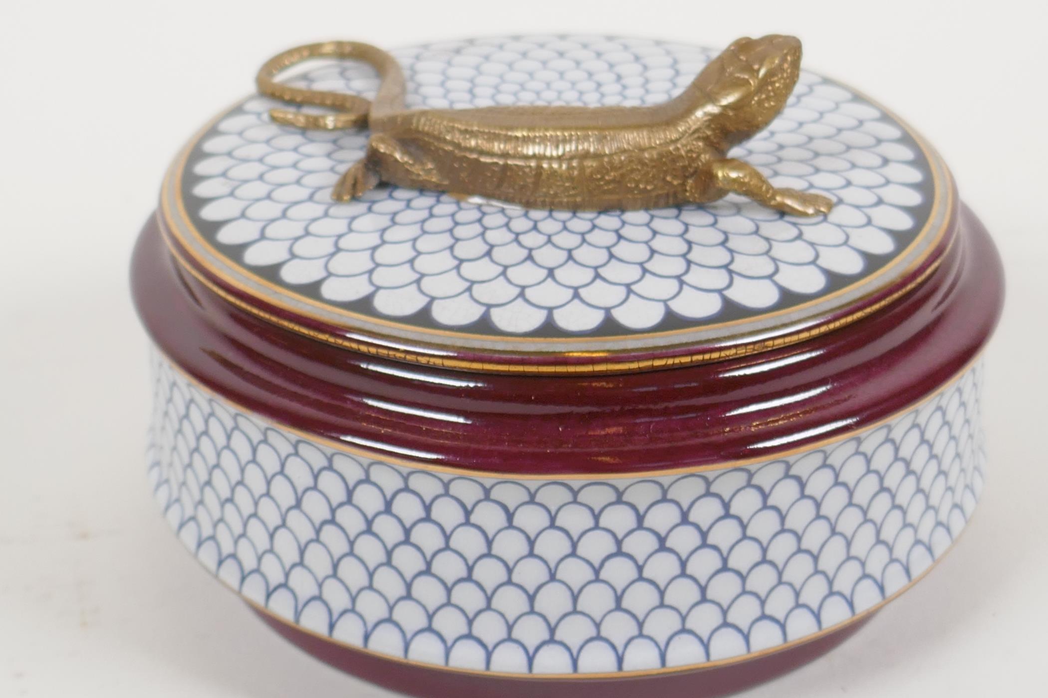 A porcelain trinket box, the cover with a bronzed figure of a lizard, 5½" diameter - Image 10 of 12